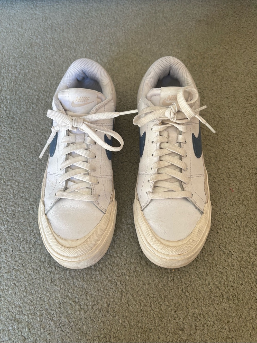Nike White Low-Top Sneakers with Blue Swoosh